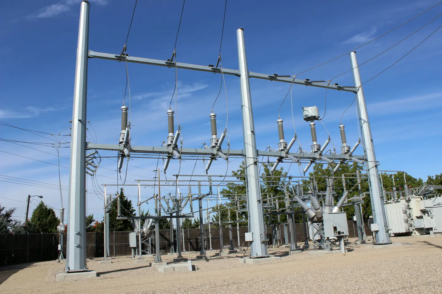 Galvanized steel substation structures carrying insulators and switches
